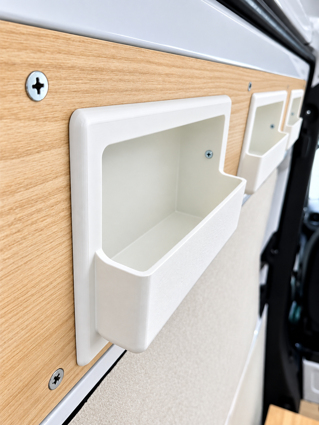 Three white recessed sliding door storage boxes for Mercedes Sprinter from Barn House Studio