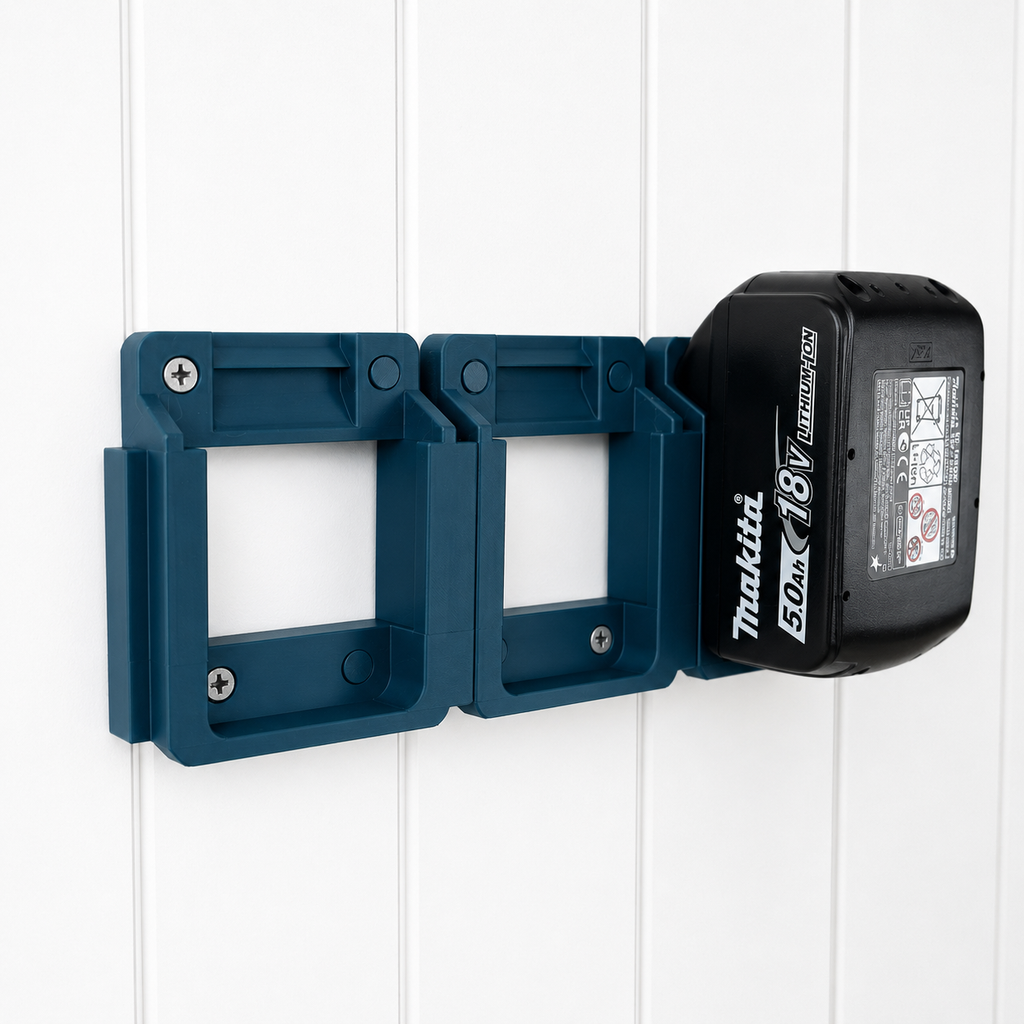 Blue Makita battery holder with a battery attached on a white wooden background