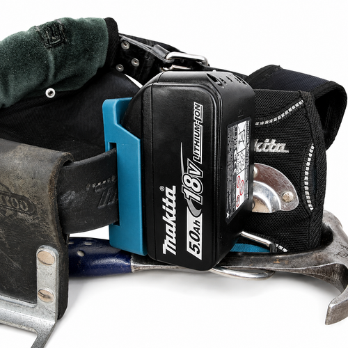 Makita battery pack attached to a tool belt with tools on a white background