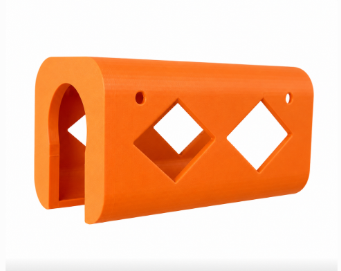 Orange tool holder with diamond-shaped cutouts on a white background